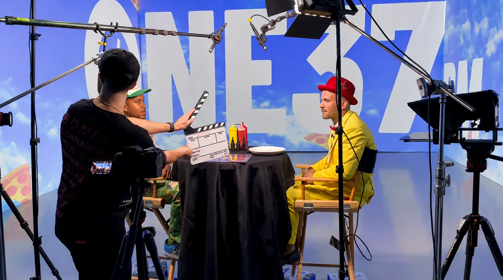 Multi-camera talk show shoot in front of projected graphics